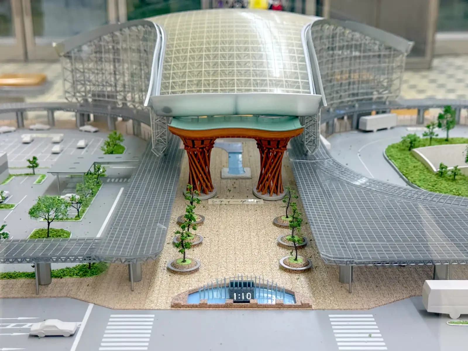 A scale model of Kanazawa Station's east exit on display inside the station, showing the Tsuzumi Gate, the Motenashi Dome, the covered walkways and the water clock fountain.