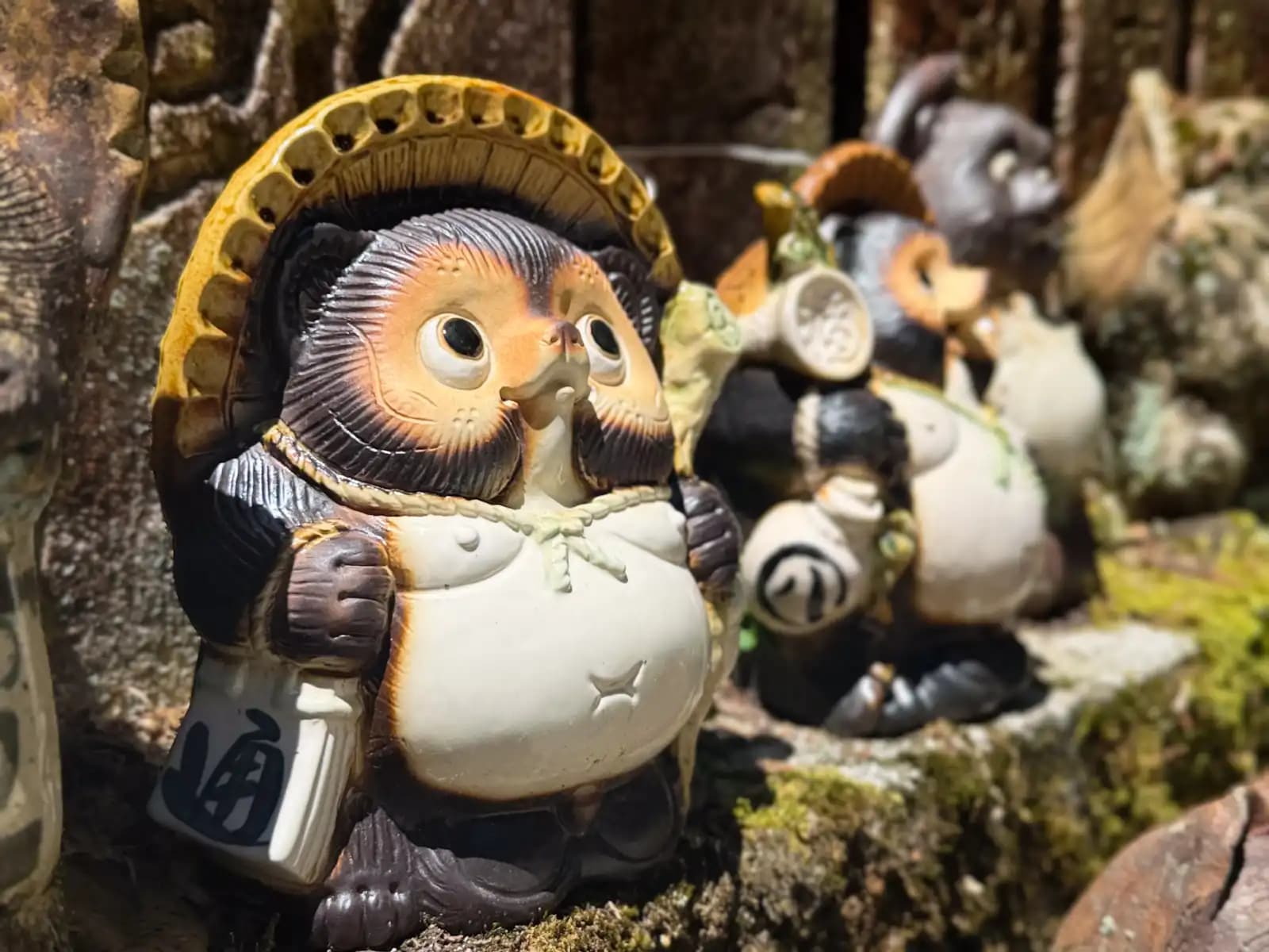 A well-kept tanuki with his sake flask, round-bellied and content.
