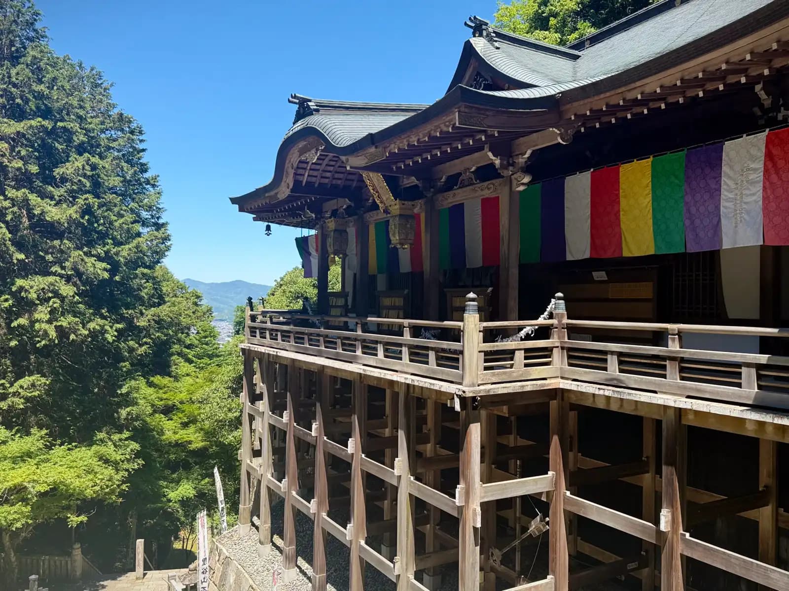 The hall's Kiyomizu-style stage juts out on timber pillars over the valley, the hills of Kyoto beyond.