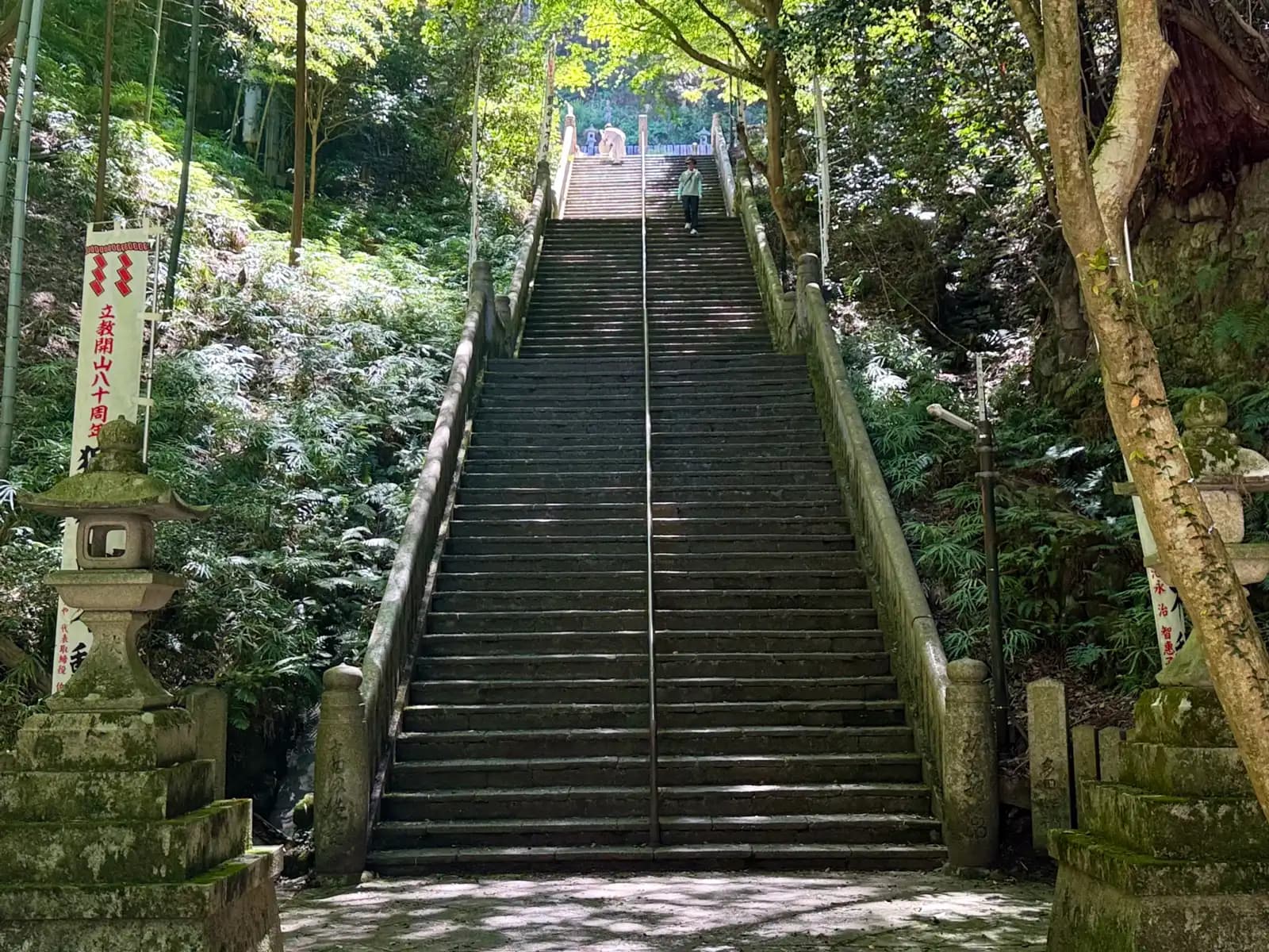 The main stone staircase: 250 steps up to the hall, with a single figure making the descent.
